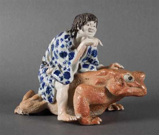 Appraisal: Japanese porcelain figural group of a man riding a giant