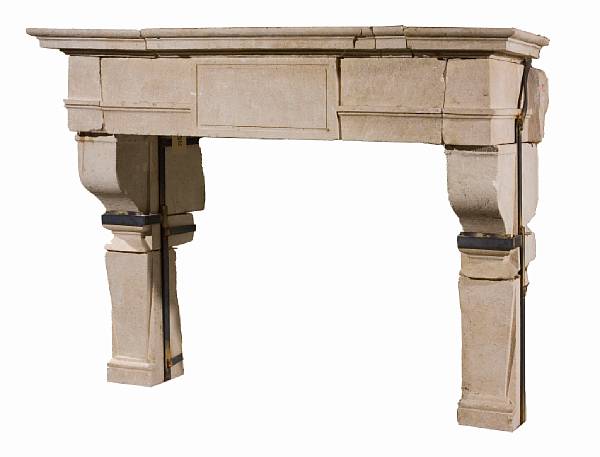 Appraisal: A Louis XIII style limestone fireplace surround The rectangular mantel