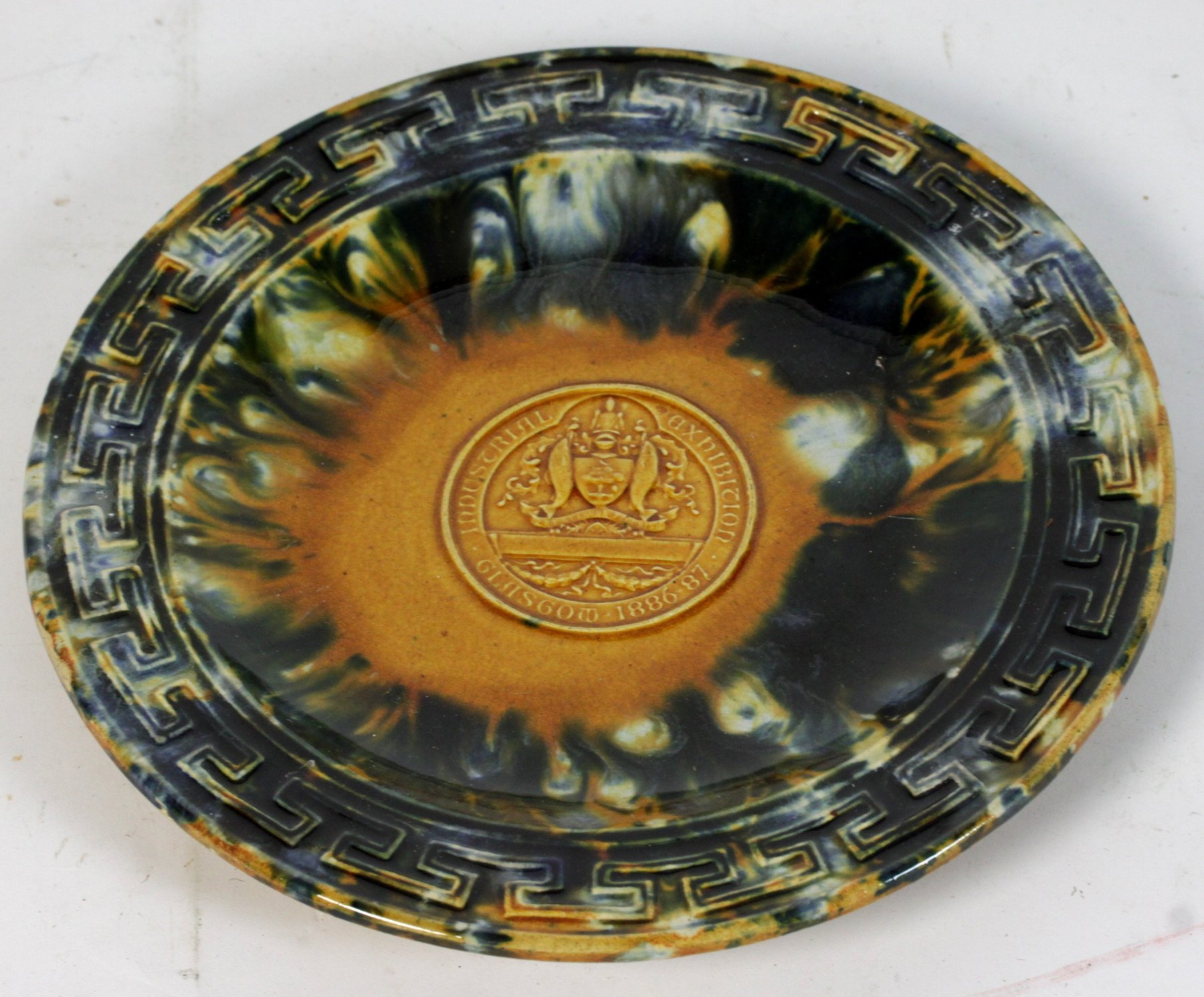 Appraisal: A Dunmore pottery plate commemorating the Glasgow Industrial Exhibition -