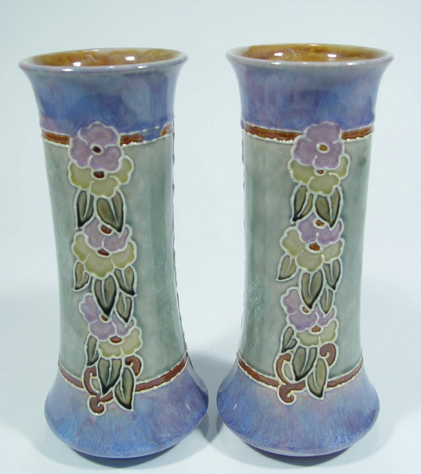 Appraisal: Pair of Royal Doulton stoneware vases relief moulded with flowers