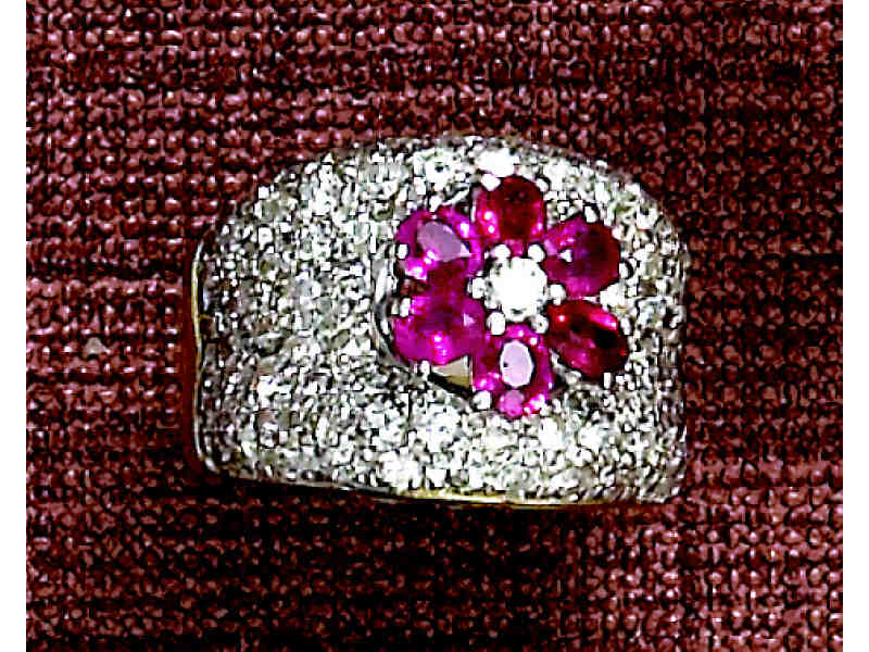 Appraisal: DIAMOND AND RUBY RING k yellow gold ring with white