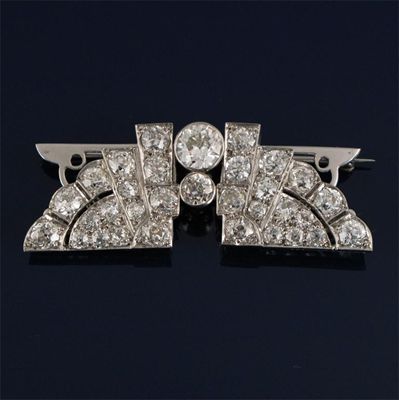 Appraisal: An Egyptian style Art Deco diamond double clip brooch set