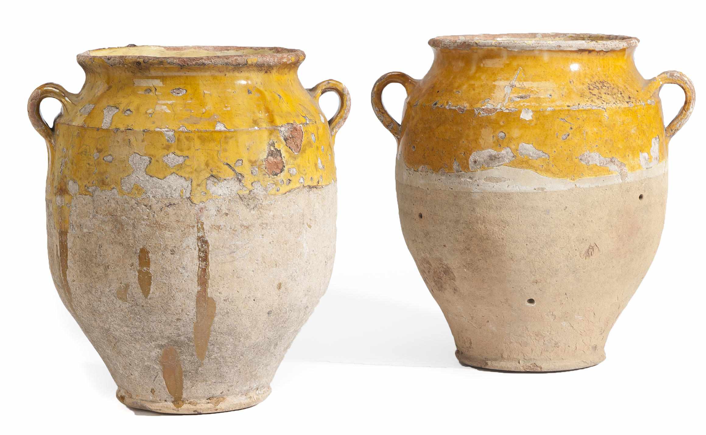 Appraisal: Two Mediterranean parcel glazed earthenware jars height of tallest in