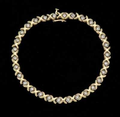 Appraisal: A Ladies' Gold and Diamodn XO Bracelet k yellow gold