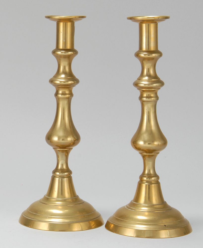 Appraisal: PAIR OF BRASS PUSH-UP CANDLESTICKS th CenturyIn vasiform Height Property