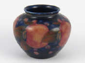 Appraisal: A small Moorcroft bowl in the pomegranate design on blue