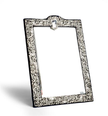 Appraisal: A Victorian silver-mounted mirrored easel frame William Comyns London the