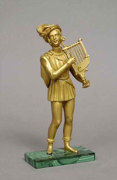 Appraisal: Continental Gilt-Bronze Figure of a Minstrel on Malachite Plinth in