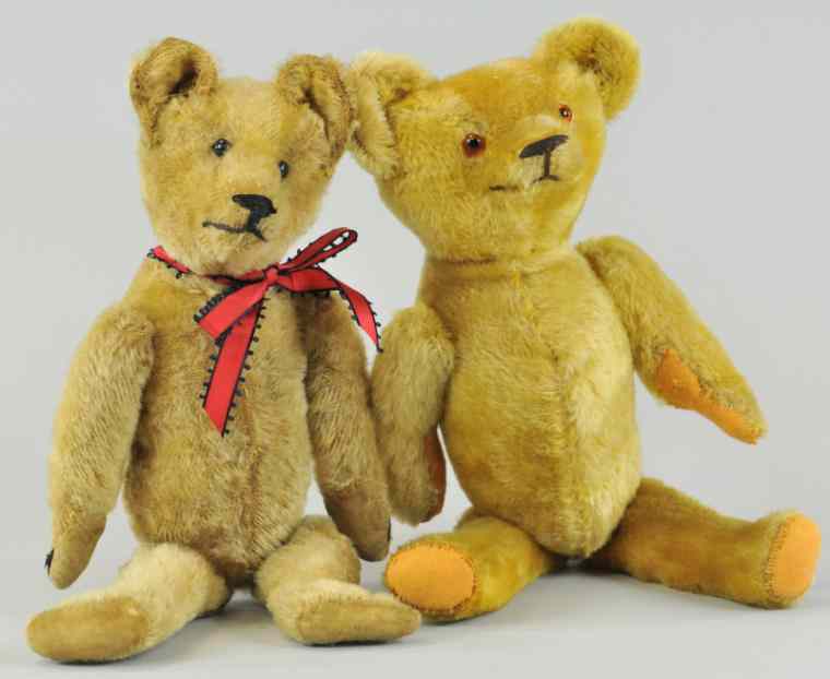 Appraisal: PAIR OF TEDDY BEARS Early American bears one tall torso