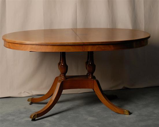 Appraisal: A Blond Mahogany Dining Table in the Duncan Phyfe taste