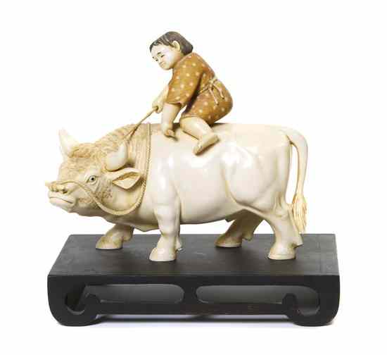 Appraisal: A Japanese Ivory Carving of a Boy on a Buffalo