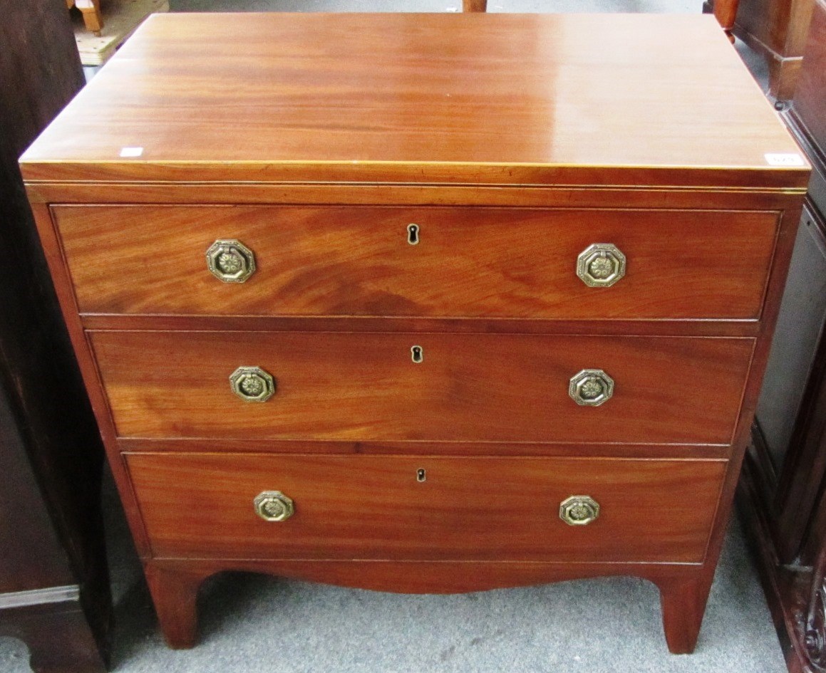 Appraisal: A George III satinwood banded mahogany chest of three long