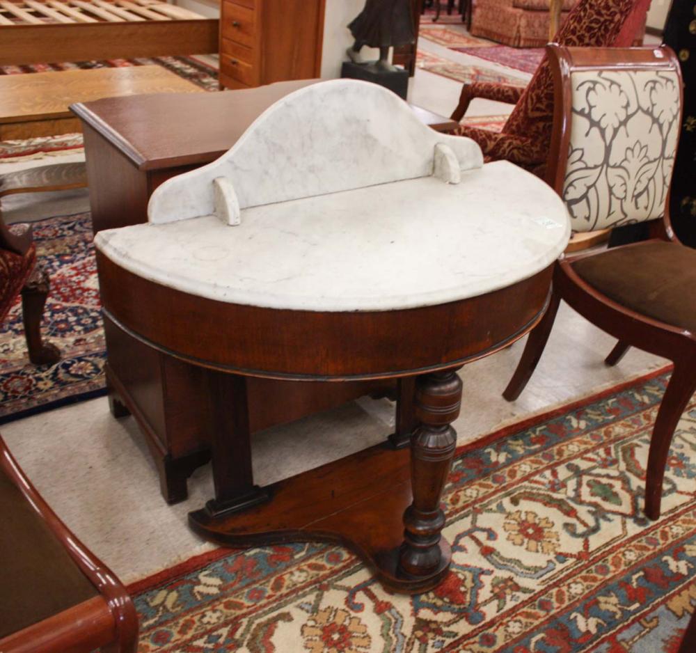 Appraisal: A VICTORIAN MARBLE-TOP MAHOGANY CONSOLE TABLE fitted with a white