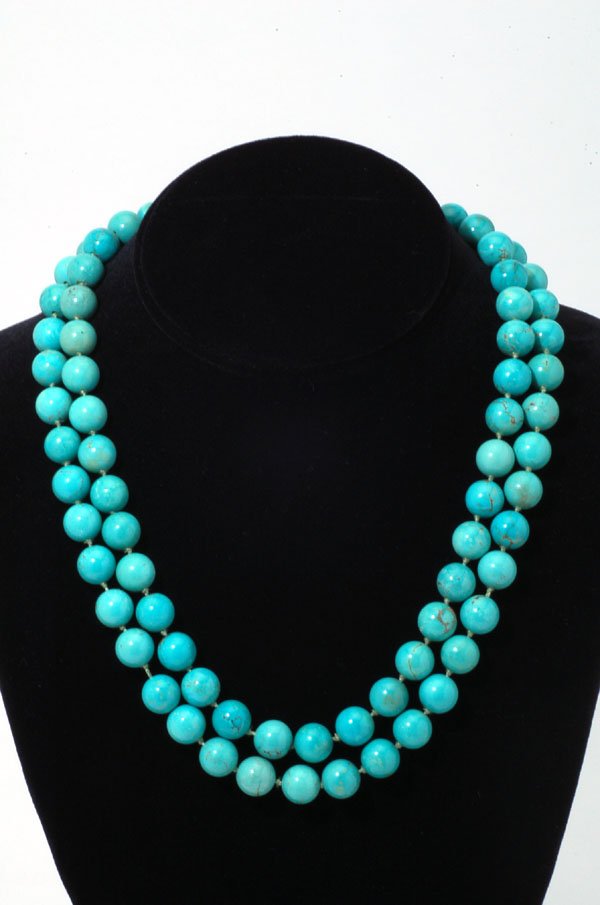 Appraisal: Turquoise knotted double strand bead necklace with marked K yellow