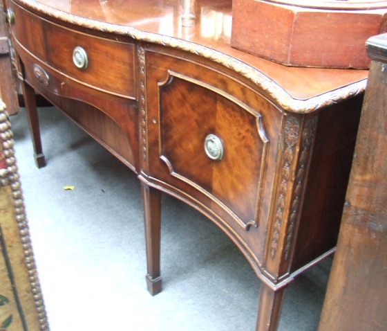 Appraisal: A George III style sideboard the ledge back over a