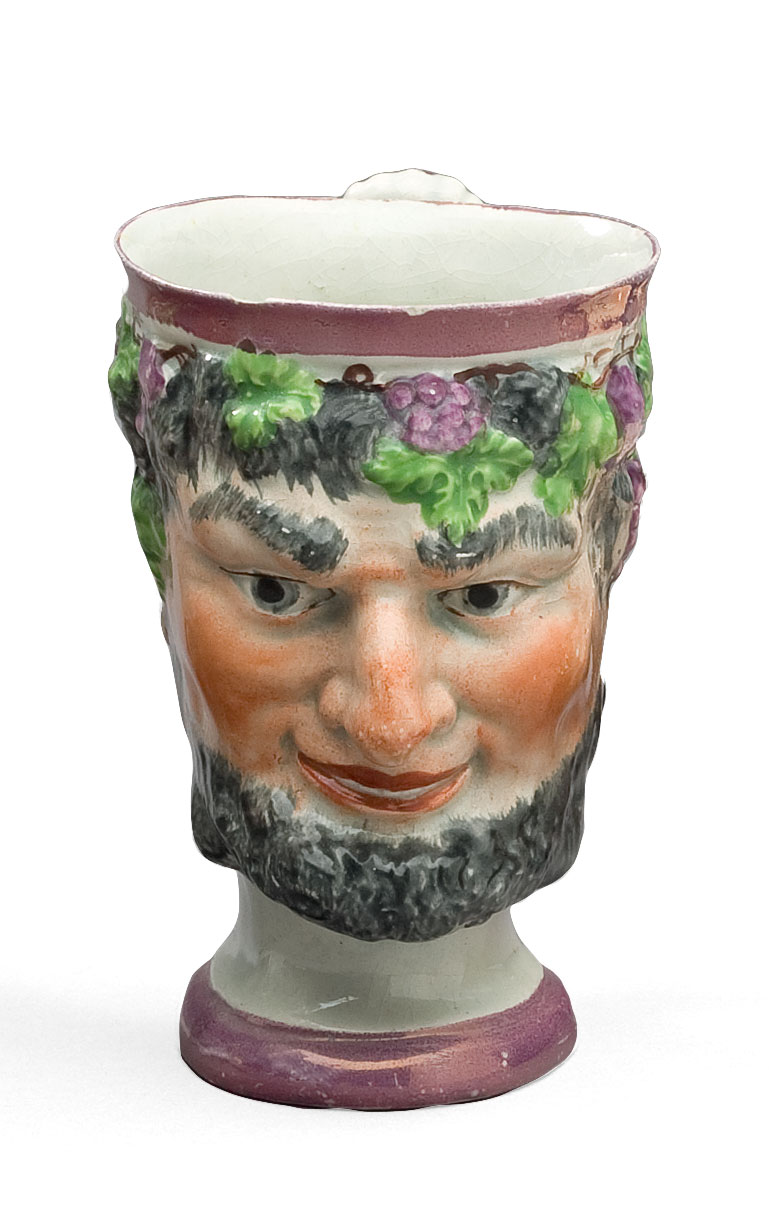 Appraisal: STAFFORDSHIRE PINK LUSTRE AND ENAMEL-DECORATED SATYR MUG CIRCA - The