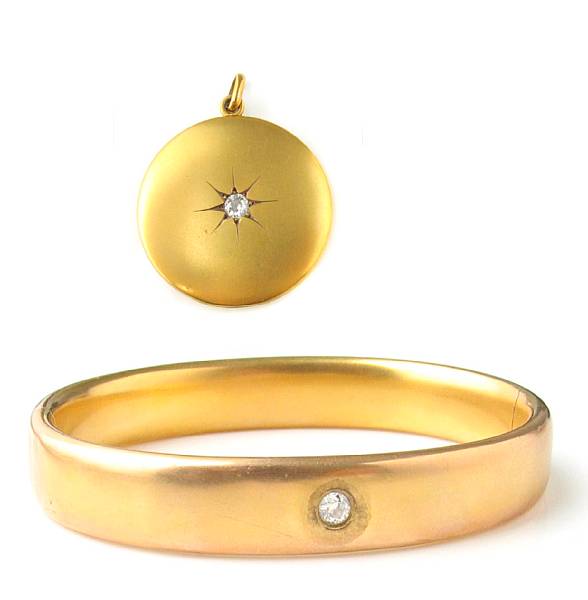 Appraisal: A k gold gold bangle with diamond and matching pendant