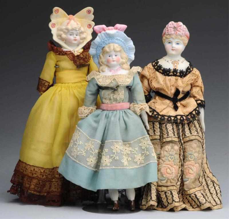 Appraisal: Lot of German Bisque Bonnet Dolls All with shoulder heads