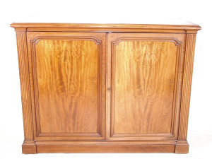 Appraisal: A dwarf mahogany linen press mid th century the bolection