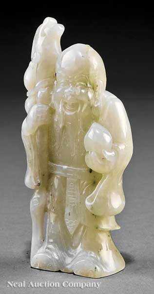 Appraisal: A Chinese White Jade Figure of Shoulao the standing happy