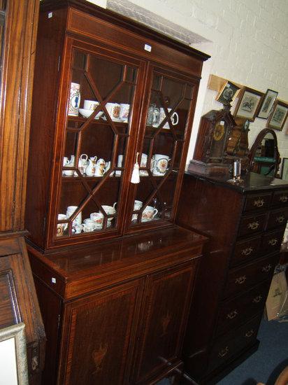 Appraisal: An Edwardian mahogany and satinwood cross banded bookcase cabinet the