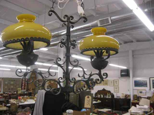 Appraisal: Wrought Iron Hanging Light two butterscotchshades