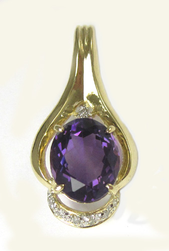 Appraisal: AMETHYST DIAMOND AND FOURTEEN KARAT GOLD PENDANT set with seven