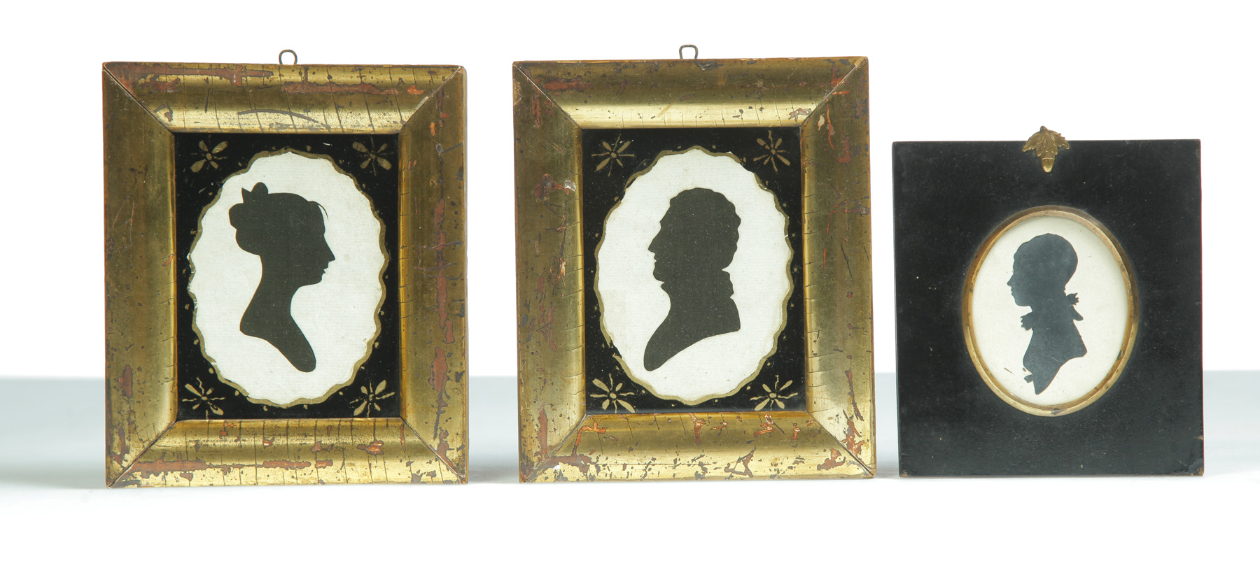 Appraisal: THREE FRAMED HOLLOW CUT SILHOUETTES American nd quarter- th century