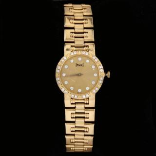 Appraisal: Lady's KT and Diamond Dancer Watch Piaget quartz movement the