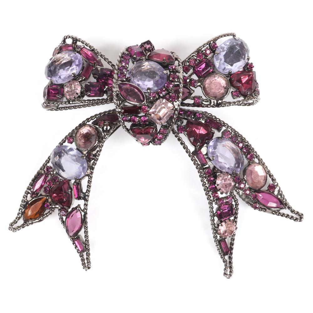 Appraisal: LAWRENCE VRBA GIANT MULTI FACETED LAVENDER CRYSTAL DIAMANTE BOW STATEMENT