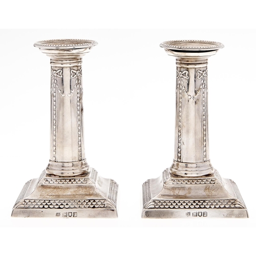 Appraisal: A pair of Edwardian silver dwarf columnar candlesticks stamped with