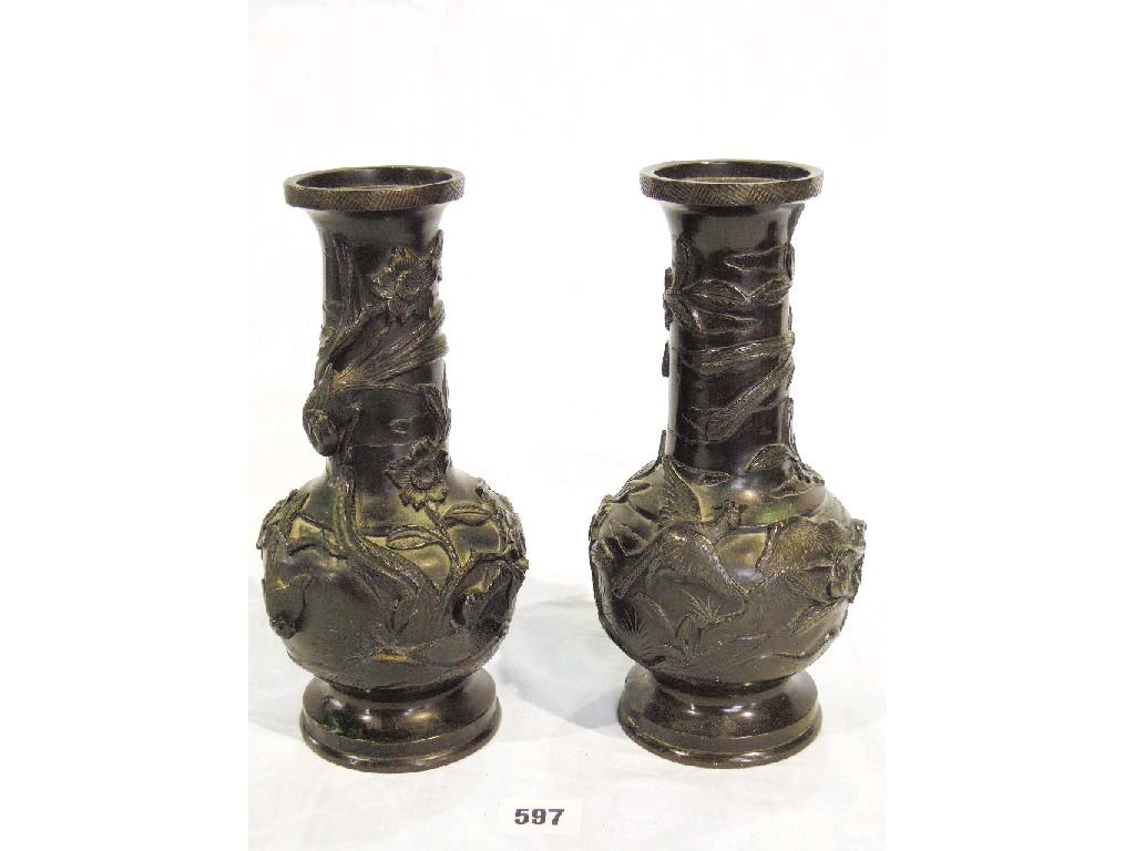 Appraisal: A pair of Chinese bronze vases with all over bird