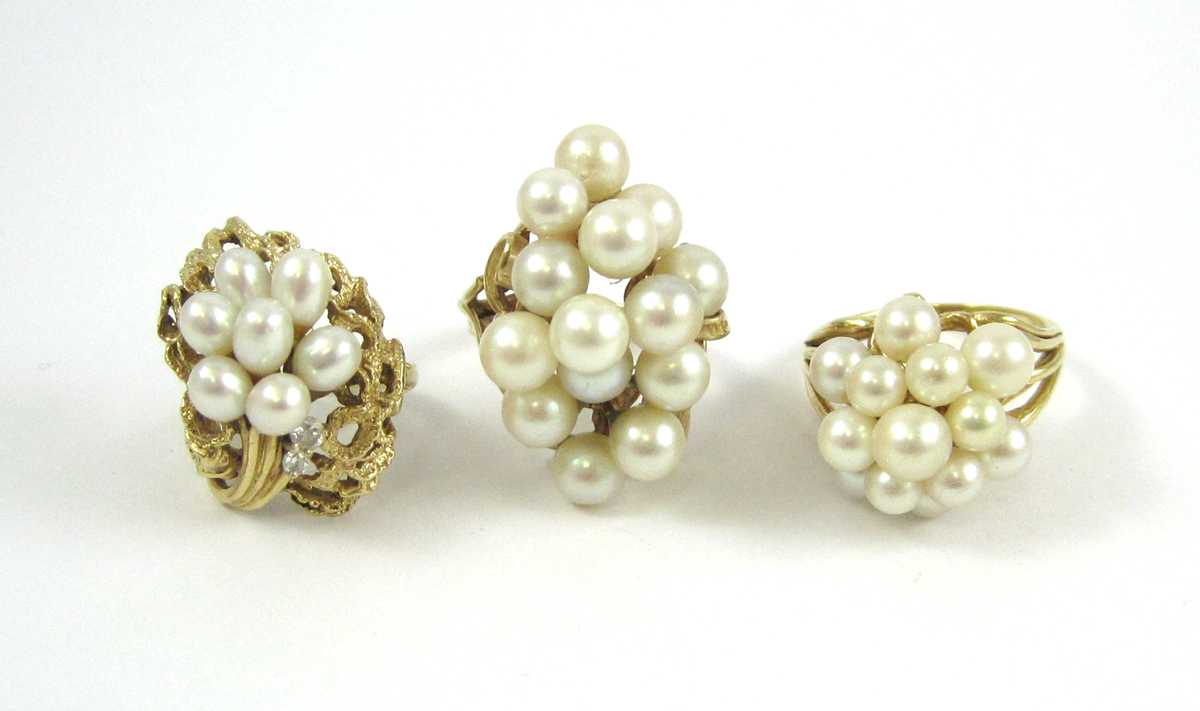 Appraisal: THREE PEARL AND FOURTEEN KARAT GOLD CLUSTER RINGS including a