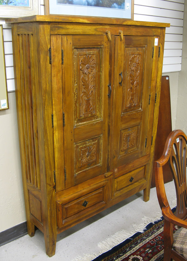 Appraisal: ANGLO-INDIAN CARVED TEAKWOOD KITCHEN CABINET the front featuring a pair