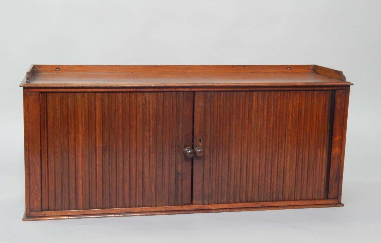 Appraisal: A Victorian mahogany and oak hotel post cupboard the galleried