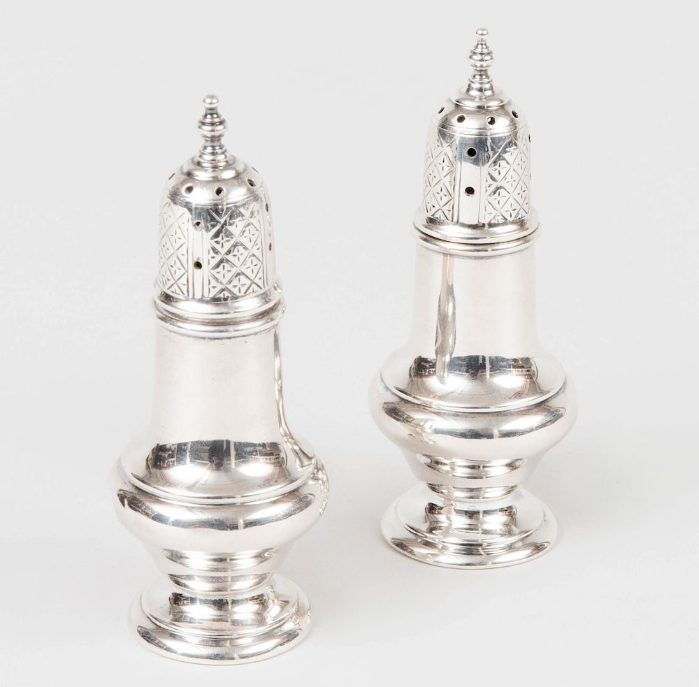 Appraisal: Pair of Small Silver Casters and Covers The bases marked