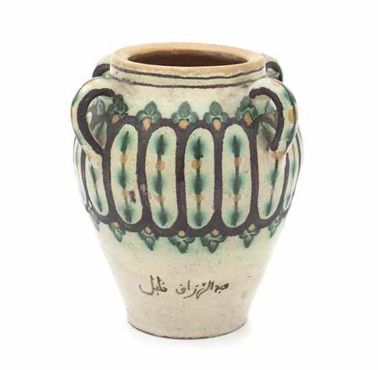 Appraisal: A Persian Ceramic Vase of baluster form with four ring