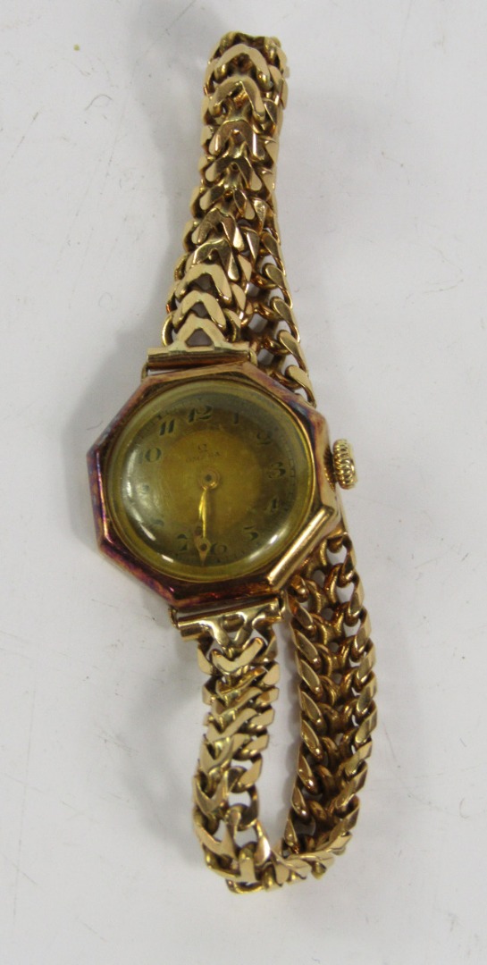 Appraisal: An Omega lady's yellow metal cased wristwatch octagonal dial bearing