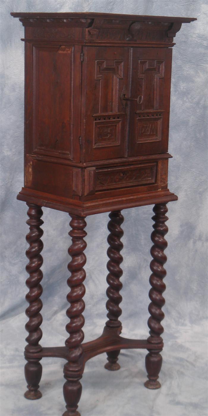 Appraisal: English oak Jacobean wall cupboard with carved dates and initials