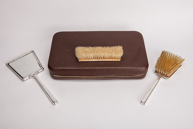 Appraisal: A CASED SILVER THREE PIECE DRESSING TABLE SET comprising two