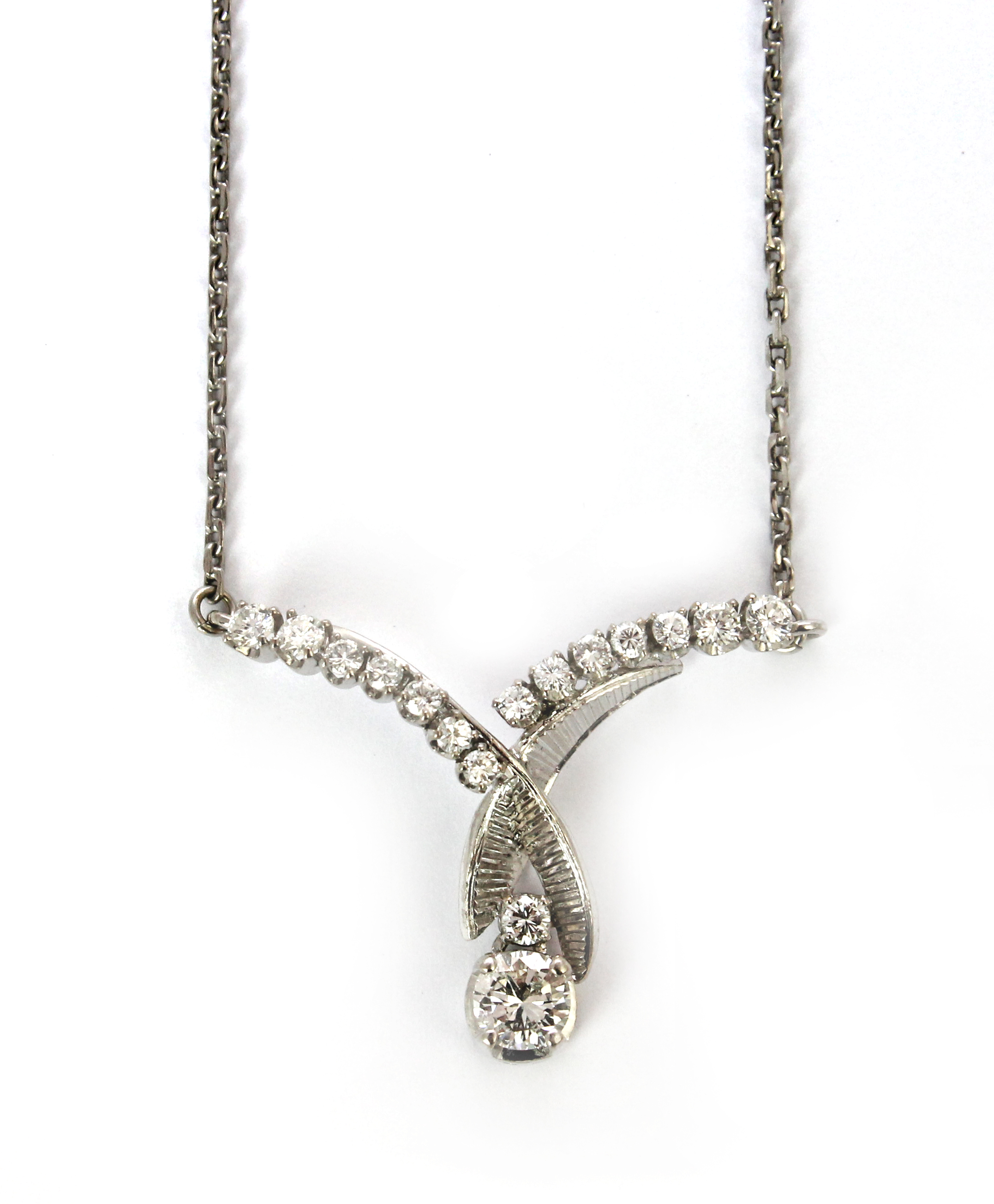 Appraisal: A diamond set pendant necklace claw set with the principle