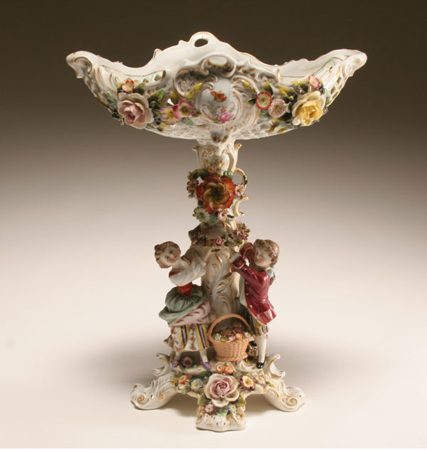 Appraisal: Austrian porcelain floral encrusted compote on figural base lattice design