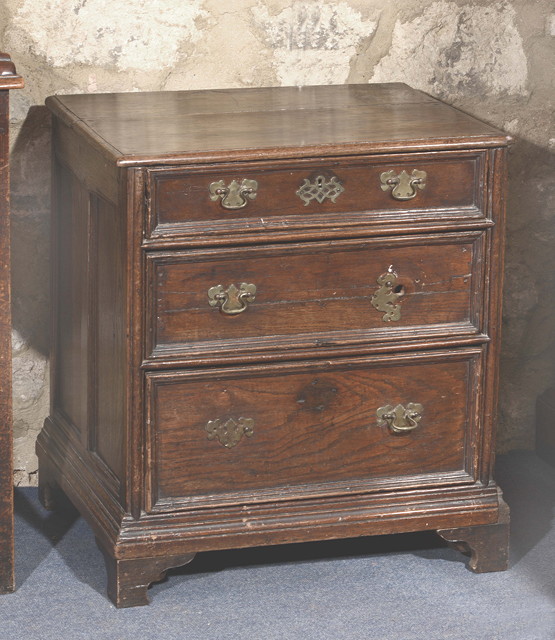 Appraisal: A GEORGE III MAHOGANY CHEST the top with a moulded