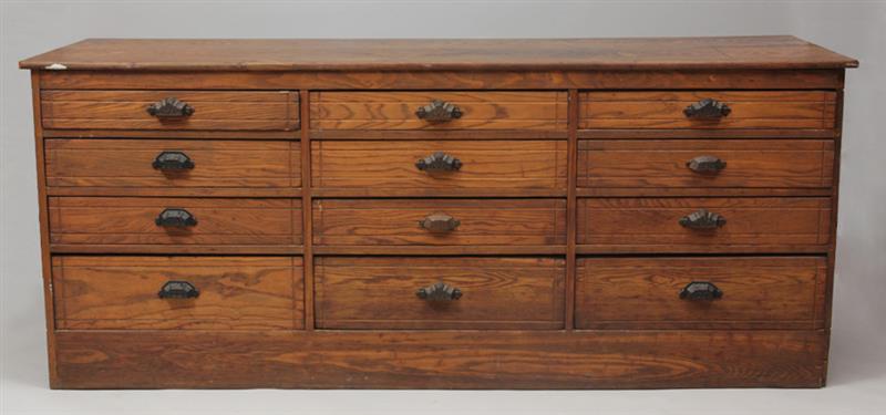 Appraisal: Vintage Oak Two-Sided Merchant's Chest The flow-through drawers with cast-iron