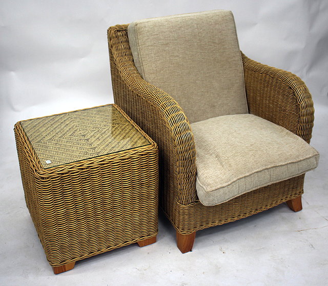 Appraisal: A SET OF FOUR RATTAN CONSERVATORY CHAIRS with upholstered cushions