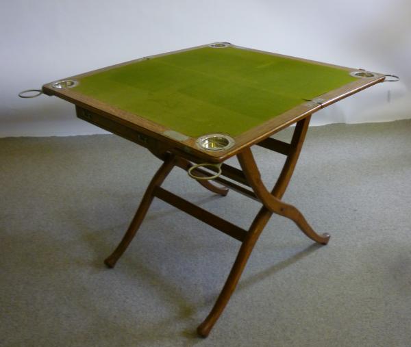 Appraisal: A VICTORIAN OAK CAMPAIGN CARD TABLE of rounded oblong folding