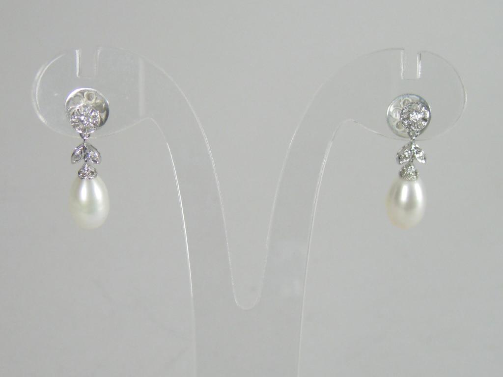 Appraisal: A pair of Diamond and Pearl Earrings each with pave-set