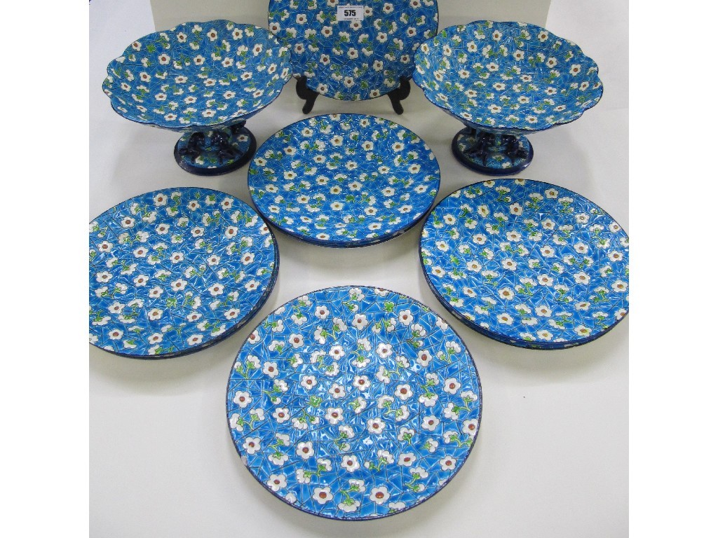 Appraisal: Longwy Pottery dessert service decorated with white flowers on blue