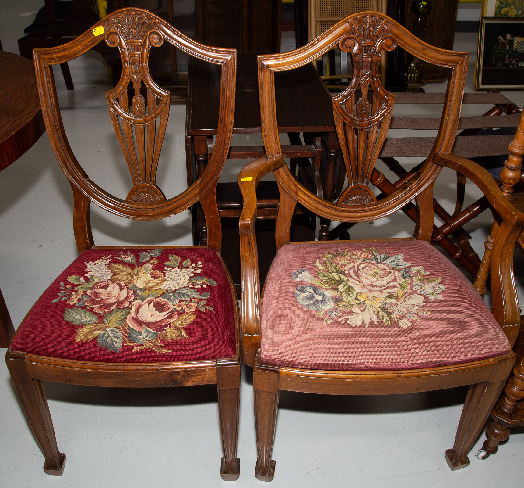 Appraisal: A PAIR OF REGENCY STYLE CARVED MAHOGANY CHAIRS Bench made