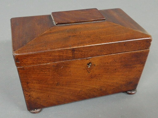 Appraisal: George III mahogany tea caddy with sarcophagus top h x